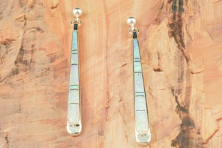 Stunning Fire and Ice Lab Opals inlaid between ribbons of Sterling Silver. Beautiful Sterling Silver Post Earrings feature precision channel inlay. Designed by Navajo Artist Calvin Begay. Signed.
